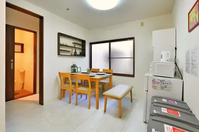 a kitchen and dining room with a table and chairs at miraisya shinkoiwa in Tokyo