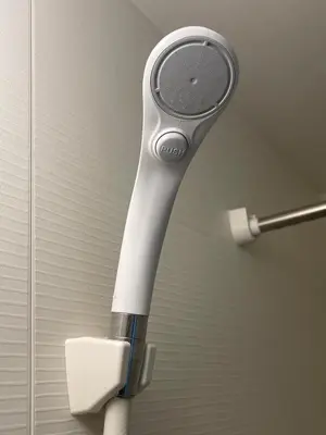 a hair dryer hanging on a wall next to a toilet at Central Tokyo,Skytree 2min by train,Akihabara 6min,Asakusa 10min,Shinjuku 22min direct access for each in Tokyo