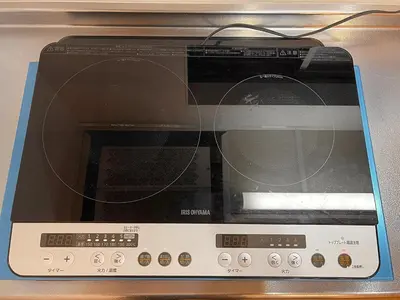 a microwave oven sitting on top of a stove at Central Tokyo,Skytree 2min by train,Akihabara 6min,Asakusa 10min,Shinjuku 22min direct access for each in Tokyo