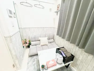 a small living room with a couch and a table at Green house Japan in Tokyo