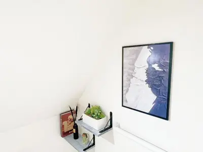 a room with a painting on the wall at Green house Japan in Tokyo