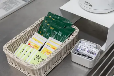 a wicker basket with a cell phone on a table at DREAM STAY Urayasu in Tokyo