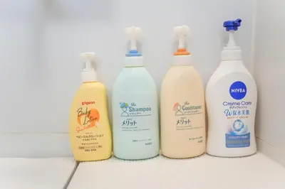 a group of four bottles of cleaning products on a counter at Asakusa 5 Chome One Bedroom KazeNoItsu 101 in Tokyo