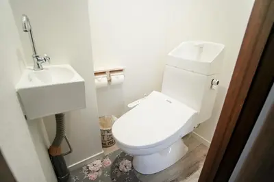 a bathroom with a white toilet and a sink at Asakusa 5 Chome One Bedroom KazeNoItsu 101 in Tokyo