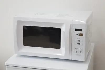 a white microwave oven sitting on top of a counter at Oliver 501 in Tokyo