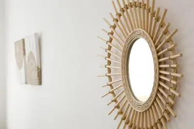 a mirror hanging on a wall next to a picture at Oliver 501 in Tokyo