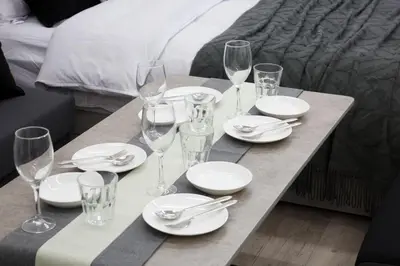 a table with plates and wine glasses on it at Oliver 502 in Tokyo
