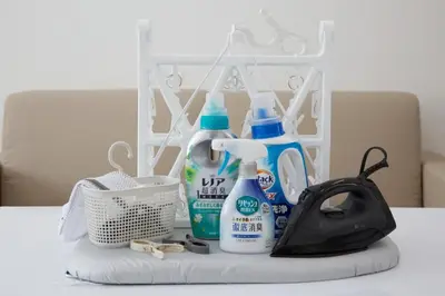 a counter with bottles of cleaning products and a bag at Oliver 502 in Tokyo