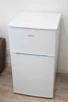 a white dresser in a room with a white wall at Oliver 502 in Tokyo