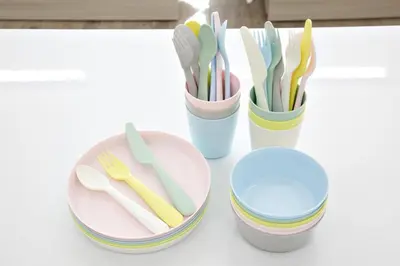 a group of plastic utensils in cups on a table at Oliver 502 in Tokyo