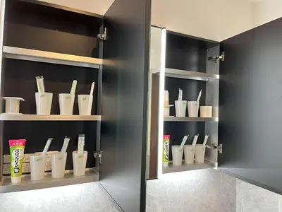 a cupboard with some utensils in it at \u6771\u4eac\u6d45\u8349\u30a4\u30f3501 in Tokyo