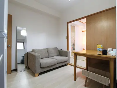 a living room with a couch and a table at New\u5927\u4e45\u4fdd 2 bedroom tatami room in Tokyo