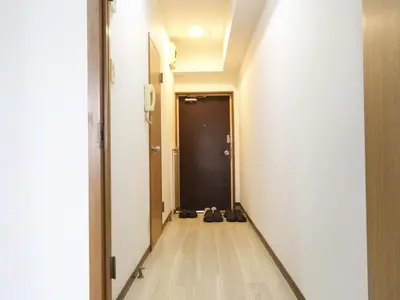 a hallway with a black door and shoes on the floor at New\u5927\u4e45\u4fdd 2 bedroom tatami room in Tokyo