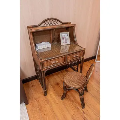 an old wooden desk with a chair and a picture at Asuka Guesthouse \u5bbf-\u98db\u9ce5 in Tokyo