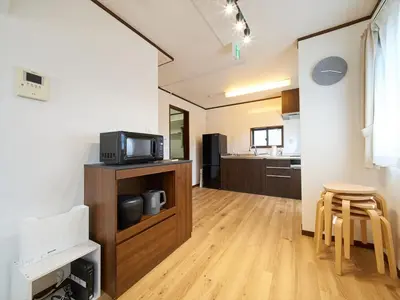 a living room with a tv and a kitchen at The Prime TOKYO SKYTREE - Vacation STAY 66636v in Tokyo