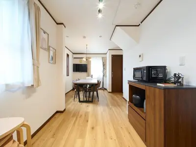 a kitchen and dining room with a table and a microwave at The Prime TOKYO SKYTREE - Vacation STAY 66636v in Tokyo
