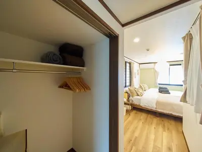 a room with a bed and a bedroom with a window at The Prime TOKYO SKYTREE - Vacation STAY 66636v in Tokyo