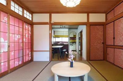 a room with a table and chairs in a building at The Sakura House - Great access to Ikebukuro, Shinjuku, Shibuya, more - Private 4DK detached house - 1 shower and 2 toilets - Experience Japanese culture in Tokyo