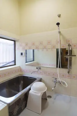 a bathroom with a tub and a toilet and a sink at The Sakura House - Great access to Ikebukuro, Shinjuku, Shibuya, more - Private 4DK detached house - 1 shower and 2 toilets - Experience Japanese culture in Tokyo