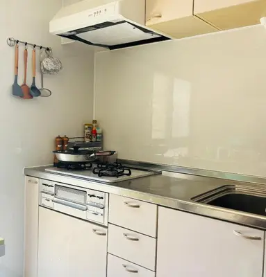 a kitchen with a stove and a sink at sunflower house in Tokyo