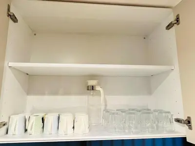 a shelf with glasses and a jug on it at Arashi - Ikebukuro 10 min Shinjuku 20 min in Tokyo
