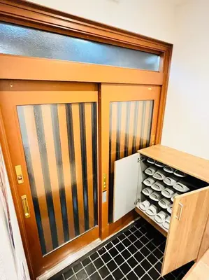 a garage door with a drawer full of wine bottles at Arashi - Ikebukuro 10 min Shinjuku 20 min in Tokyo