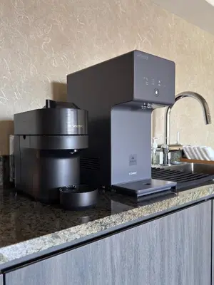 a kitchen with a coffee machine on a counter at suirow \u7fe0\u697c in Tokyo