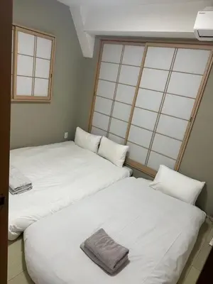 two beds sitting next to each other in a room at Otsuka, Bunkyo-ku, House-BK0457 in Tokyo