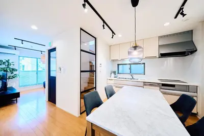a kitchen and dining room with a table and chairs at SATELLITE HOTEL Yoyogi Park \u30b5\u30c6\u30e9\u30a4\u30c8\u30db\u30c6\u30eb\u4ee3\u3005\u6728\u516c\u5712 in Tokyo