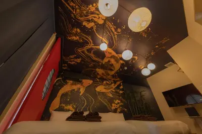 a bedroom with a painting on the wall at Luum Stay Shibuya 2 in Tokyo