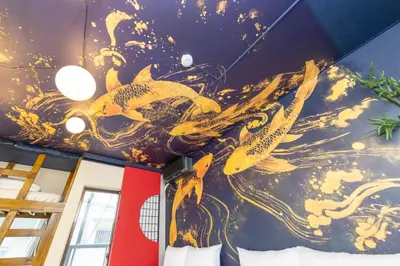 a mural on the ceiling of a room with goldfish at Luum Stay Shibuya 2 in Tokyo