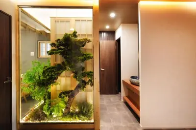 a room with a aquarium with a tree in it at \u6d45\u8349\u82d1 in Tokyo