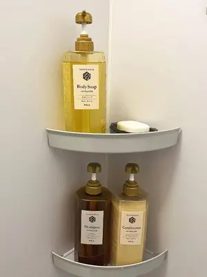 three bottles of soap are on a shelf at \u6771\u4eac\u6d45\u8349\u30a4\u30f3201 in Tokyo