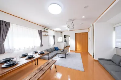 a living room with a couch and a table at ZEN HOTEL Haven in Tokyo
