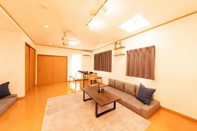 a living room with a couch and a table at ZEN HOTEL Haven in Tokyo