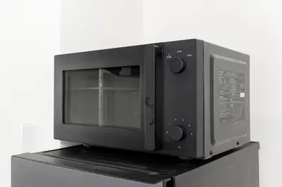 a microwave oven sitting on top of a counter at ZEN HOTEL Haven in Tokyo