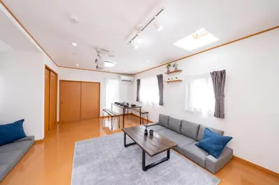 a living room with a couch and a table at ZEN HOTEL Haven in Tokyo