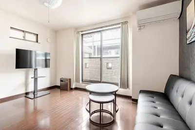 a living room with a couch and a table at jtr\u6771\u5927\u4e952\u4e01\u76ee in Tokyo