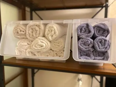 two plastic containers of donuts on a shelf at 202 Koiwa st private Room in Tokyo