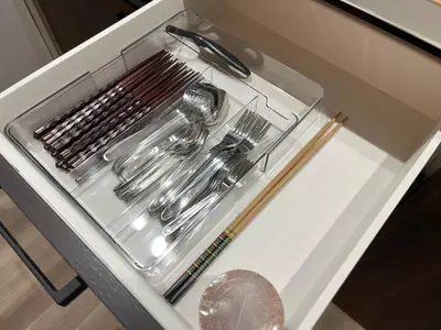 a drawer filled with silver utensils in a cabinet at \u6771\u4eac\u6d45\u8349\u30a4\u30f3401 in Tokyo