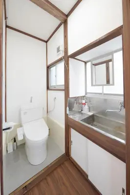 a bathroom with a toilet and a sink at KASHIMA -JR Otsuka Station- in Tokyo