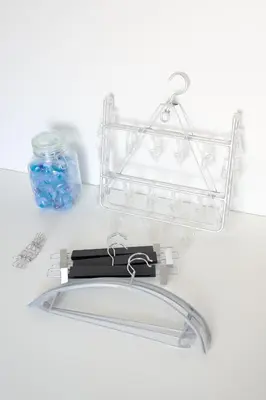 a clear acrylic shelf with a glass jar on a counter at KASHIMA -JR Otsuka Station- in Tokyo