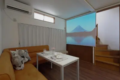 a living room with a couch and a table at KASHIMA -JR Otsuka Station- in Tokyo