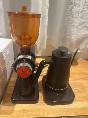 a blender sitting on top of a wooden table at Ficus Tokyo in Tokyo