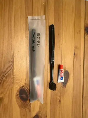 a spoon and a paper bag on a wooden table at Ficus Tokyo in Tokyo
