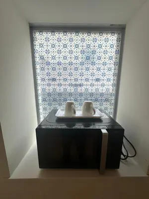 a window with a table in front of it at Ficus Tokyo in Tokyo