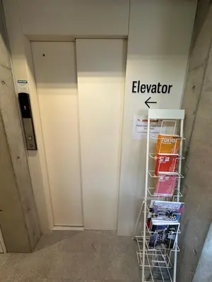 aigerator sign on a wall next to a door at Ficus Tokyo in Tokyo