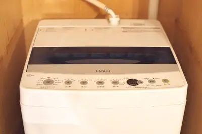a white stove top oven sitting in a kitchen at Zen Abode \u82b3 4 minutes walk from station cafe-like in Tokyo