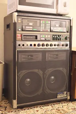 a stereo system with a microwave on top of it at Zen Abode \u82b3 4 minutes walk from station cafe-like in Tokyo