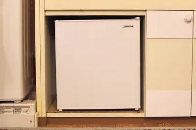 a white refrigerator sitting inside of a cabinet at Zen Abode \u82b3 4 minutes walk from station cafe-like in Tokyo